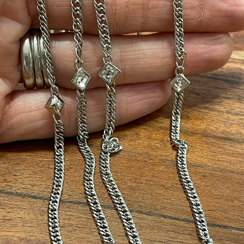 Beautiful Givenchy long necklace. Silver with white crystals.